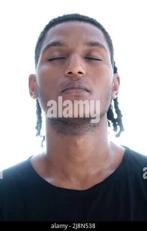 A portrait of an African American man with eyes closed Stock Photo
