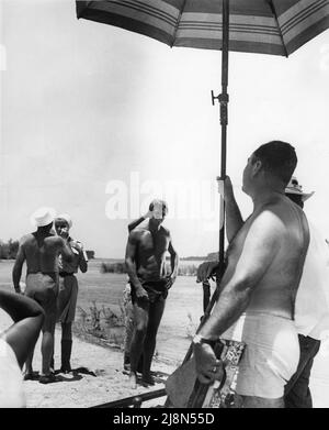 RON ELY as Tarzan in 1967 has his hair arranged on set candid near Acapulco, Mexico during filming of TARZAN TV Series 1966 - 1968 director HARMON JONES Banner Productions / National Broadcasting Company (NBC) Stock Photo