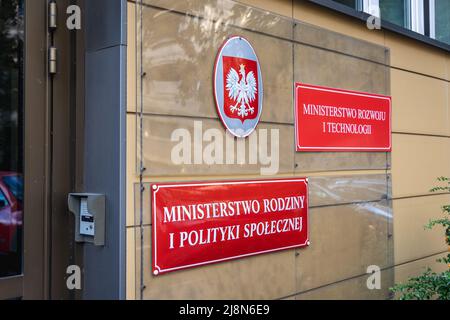 Signboard on a governmental building of Ministry of Economic Development and Technology and Ministry of Family and Social Policy in Warsaw, Poland Stock Photo