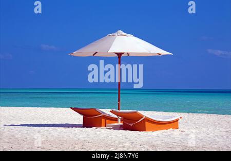 Parasol and sun chairs at the beach, Conrad Maldives, Rangali Island, South-Ari Atoll, Maldives, Indian ocean Stock Photo