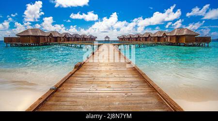 Jetty leads from the beach to luxury over-water bungalows, Maldives South-Male Atoll, Indian Ocean, Asia Stock Photo