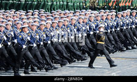 Moscow, Russia, May 2022: Cadets of the Naval Military School named after Nakhimova and the commander march in formation across Red Square. The main r Stock Photo