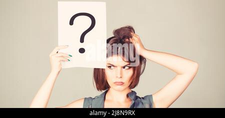 Thinking woman. Concept - challenging issue, looking for the answer. Isolated girl. Woman with doubtful expression and question marks. Question mark Stock Photo