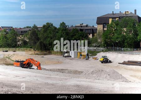 Large construction site, large excavation pit with cranes, excavators Stock Photo