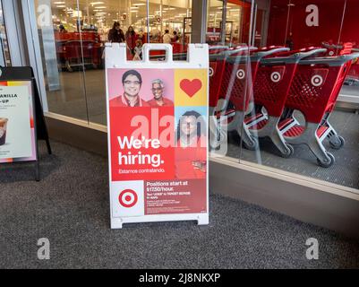 Lynnwood, WA USA - circa April 2022: Angled view of a Now Hiring sign inside a Target retail and grocery store. Stock Photo