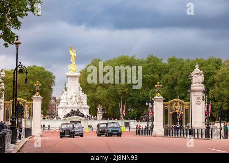 London, UK - Oct 28, 2012: Victoria Memorial and Buckingham Palace Memorial Gardens gates as seen from the Spur road Stock Photo