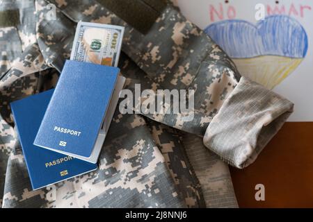 passports, money, military uniform texture of pixeled camouflage Stock Photo