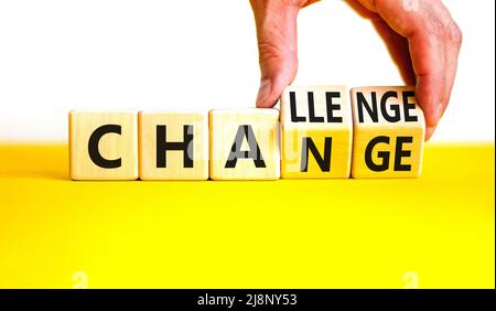 Chance or challenge symbol. Businessman turns wooden cubes and changes the concept word challenge to chance. Beautiful yellow table white background. Stock Photo