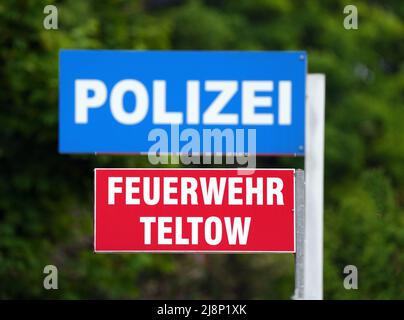 Teltow, Germany. 17th May, 2022. Signs reading 'Police' and 'Teltow Fire Department' are posted in front of the adjacent fire station and police station, respectively. Credit: Soeren Stache/dpa/Alamy Live News Stock Photo