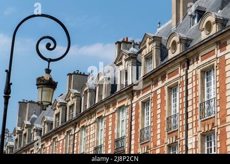 The Place des Vosges originally Place Royale, is the oldest planned square in Paris, France. It is located in the Marais district. Stock Photo