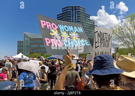 Woman holds a pro-woman pro-choice sign during a public rally on May 14, 2022, in Cleveland, Ohio, USA supporting abortion rights. Stock Photo