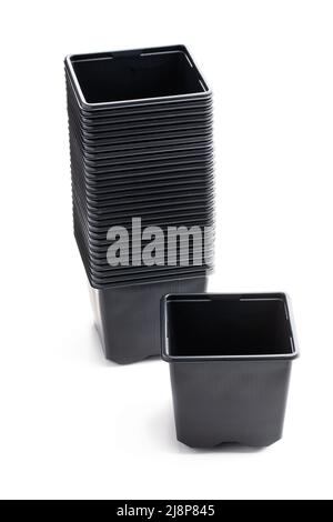 Stack  of black plastic pots isolated on white background Stock Photo