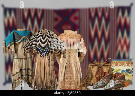 Native American art. Beautiful bags, moccasins and multicolored clothes produced by Native American artisans Stock Photo