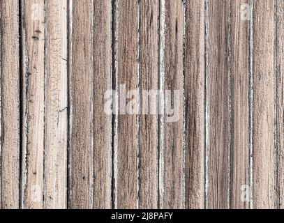 Old exterior weather pine wood vertical plank siding background Stock Photo