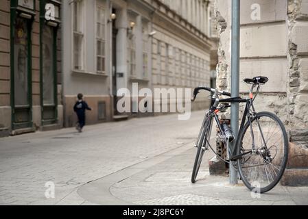 Bicycle on the old city street Stock Photo