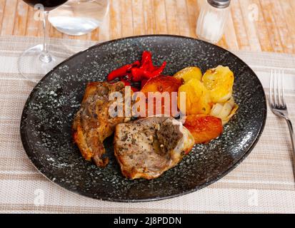 Dish of lamb leg with potatoes and pepper Stock Photo