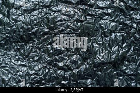 Abstract texture pattern metallic paper using as a background or wallpaper. Metal aluminum foil shiny and reflector. High quality photo Stock Photo