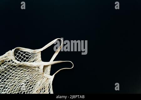 empty wicker bag for shopping on a black background isolated. High quality photo Stock Photo