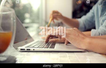 Young businesswoman and businessman working together using Stock Photo