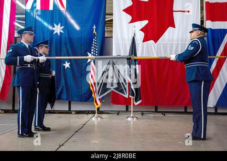 April 13, 2022 - Vandenberg Space Force Base, California, United States - Members of the Vandenberg Space Force Base Honor Guard team unfurl the new 18th Space Defense Squadron's flag during a re-designation ceremony at Vandenberg SFB, Calif., April 13, 2022. The 18th Space Control Squadron was re-designated as the 18 SDS to signify increased focus on Space Domain Awareness (SDA) command and control, integrating and synchronizing SDA capabilities in support of the contested and congested domain, and collaboration with allies and partners. The furling and unfurling of flags have been a long s Stock Photo