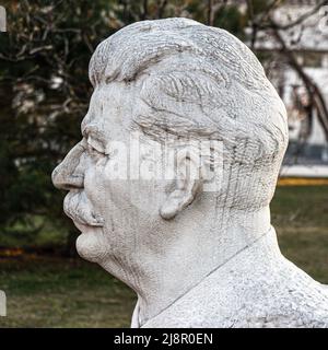 MOSCOW, RUSSIA - March 24, 2020 Side angle view of marble bust of Joseph Vissarionovich Stalin, in Fallen Monument Park. Stock Photo