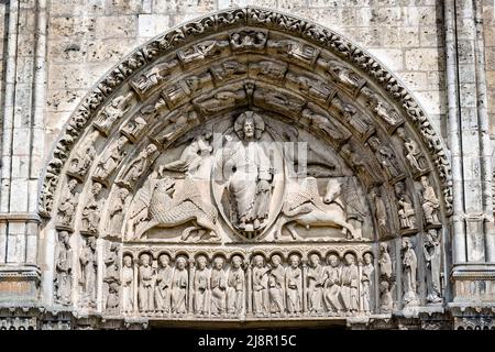Chartres, France - April 19, 2013: Central tympanum of the Royal portal at Cathedral Our Lady of Chartres, France - one of the finest examples of Fren