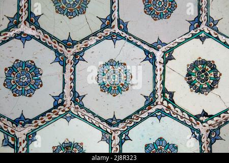 Handmade old Turkish Blue ceramic Tiles on the wall in Istanbul City, Turkey. Close up. Ancient Ottoman patterned Iznik syle design tile composition Stock Photo