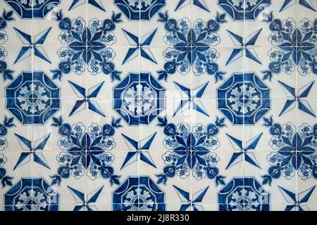 Handmade old Turkish Blue ceramic Tiles on the wall in Istanbul City, Turkey. Close up. Ancient Ottoman patterned Iznik syle design tile composition Stock Photo