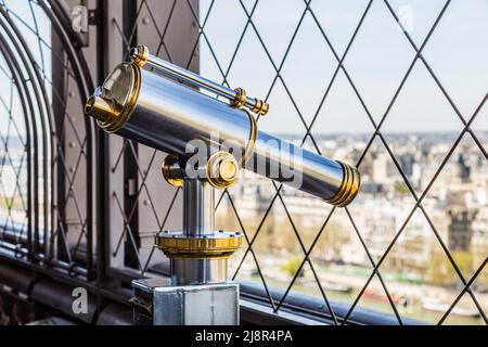 Paris, France, March 30, 2017: Eiffel Tower telescope overlooking for Paris. Old panoramic viewer or telescope on the eiffel tower top. Monocular Stock Photo