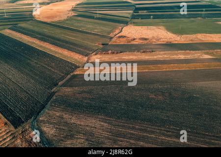 Aerial view of plowed agricultural fields in december, high angle view drone photography Stock Photo