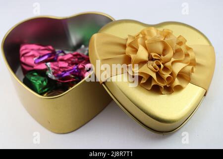 Heart shape gift box with chocolates inside on white background, Gift boxes for birthdays, valentines day and other special events Stock Photo