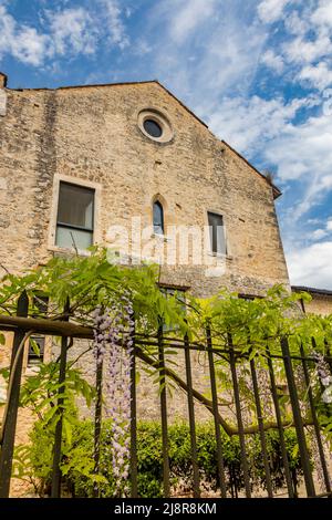 Priverno, Latina, Lazio, Italy - The Fossanova Abbey. The ancient buildings of the small medieval village built around the monastery. The garden with Stock Photo