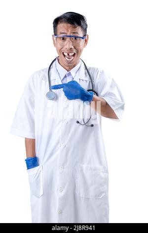 Asian nerd scientist with a stethoscope standing and pointing something isolated over white background Stock Photo