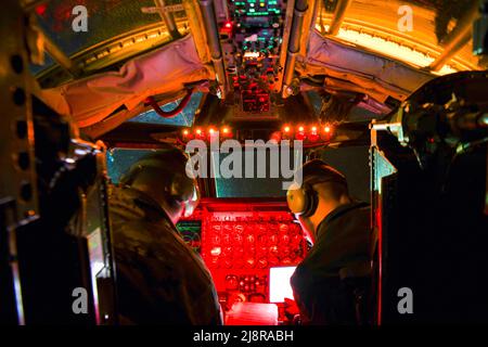 Minot AFB, North Dakota, USA. 3rd May, 2022. 69th Bomb Squadron B-52H Stratofortress Pilots Capt. Jake 'Aftr' Gill (left) and Capt. David 'Lumber' Mills (right) conduct B-52H pre-flight procedures before takeoff on May 2, 2022, at Minot Air Force Base, North Dakota. B-52Hs are equipped with advanced targeting pods which provide improved long-range target detection, identification and continuous stabilized surveillance for all missions, including close air support of ground forces. Credit: U.S. Air Force/ZUMA Press Wire Service/ZUMAPRESS.com/Alamy Live News Stock Photo