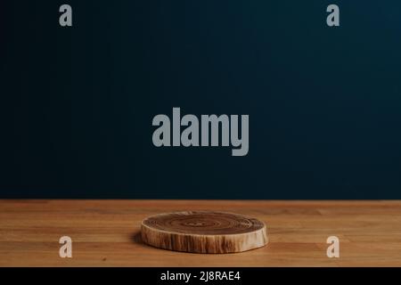 Dark blue background and wooden stand Stock Photo