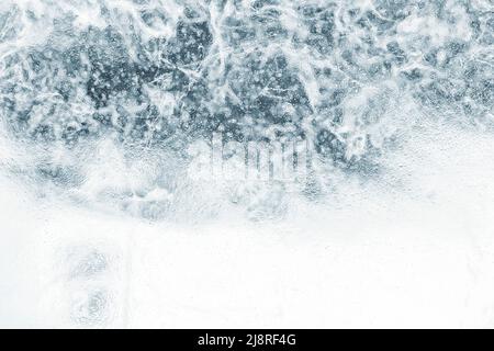 ice texture with cracks and patterns. winter background. Stock Photo
