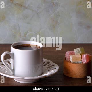 Traditional Turkish delight and Turkish coffee on a wooden background,top view Stock Photo