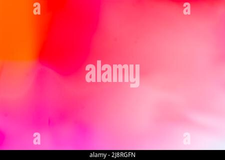 Multicolored bright background in orange, red, pink, tones. Abstraction with a smooth gradient. Backdrop Stock Photo