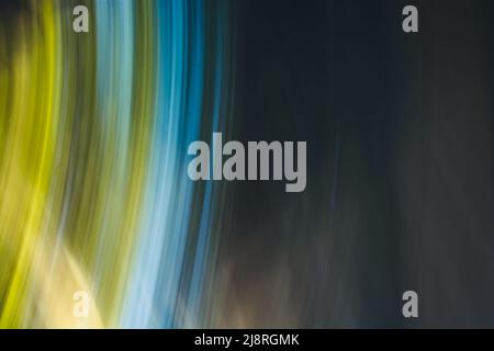 Abstract background banner in dark colors with blue and yellow-green twisted lines arcs. Backdrop Stock Photo