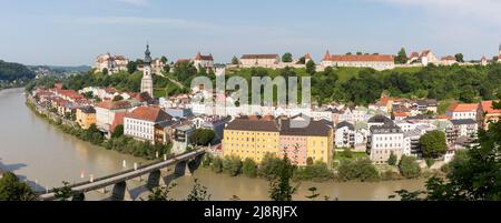 Burghausen, Germany - July 24, 2021: Panorama view on the town of Burghausen. With river Salzach, historical buildings, medieval castle and church St. Stock Photo