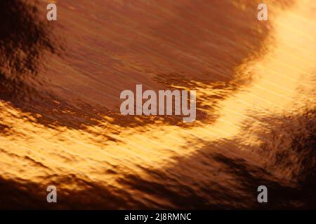 Rich copper or golden shiny background. Stock Photo