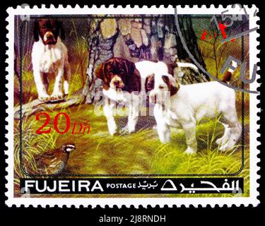 MOSCOW, RUSSIA - MAY 14, 2022: Postage stamp printed in Ajman shows Dogs, serie, circa 1971 Stock Photo