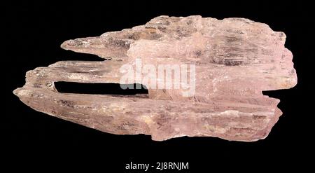 Spodumene, var. kunzite Kunzite, LiAlSi2 O6 (lithium aluminum silicate), is the pink variety of spodumene and is one of two gemstone varieties. The other variety is green and is called hiddenite. Due to kunzite's cleavage, splintery fracture and strong pleochroism, it is considered a real gem cutters challenge. However, its lovely pink color makes kunzite an attractive and desirable gemstone. from Brazil. Near Minas Gerais. Stock Photo