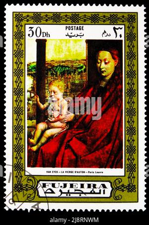 MOSCOW, RUSSIA - MAY 14, 2022: Postage stamp printed in Fujairah (Fujeira) shows Madonna of Chancellor Rolin; by Jan van Eyck, Madonna Paintings serie Stock Photo