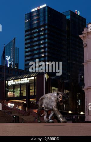 Oslo, Norway. 01 May 2022: Sculpture of iron tiger on main square of Norwegian city of Oslo, view at night from front vertically. Stock Photo