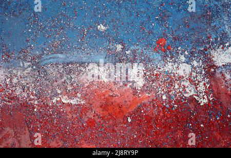 Colorful paint peeling on stone wall Stock Photo