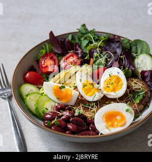 Medium boiled eggs with sasld, healthy breakfast Stock Photo