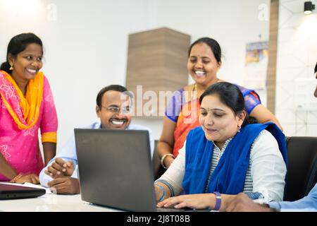 happy smiling Group of corporate employees during meeting at office - concept of teamwork, communication and happiness. Stock Photo