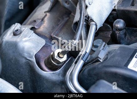Automotive sensor lambda probe in a diesel engine. Measuring oxygen content in car exhaust gases Stock Photo