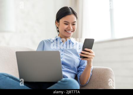 Cute korean lady freelancer working from home Stock Photo